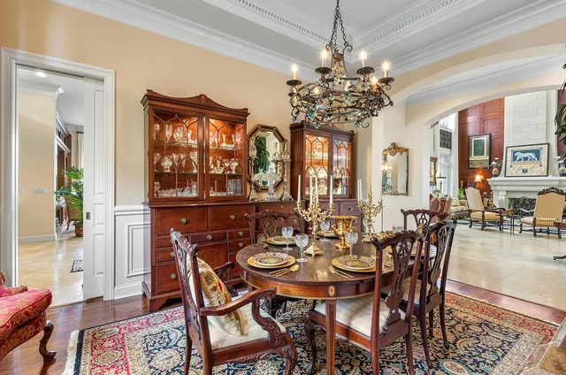 a view of a dining room with furniture wooden floor and chandelier