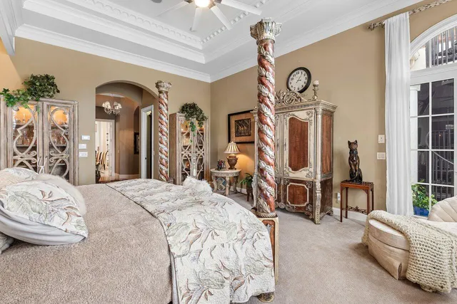 a view of a dining room with furniture and chandelier