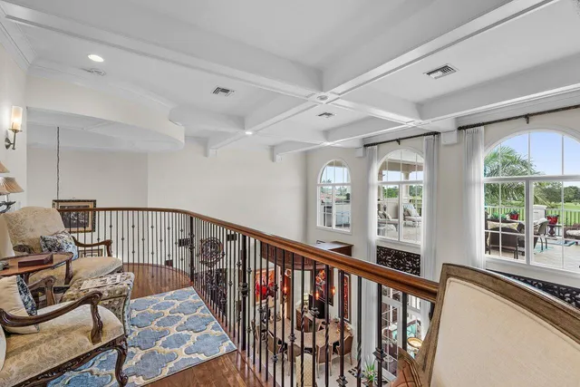 a view of living room with furniture and wooden floor
