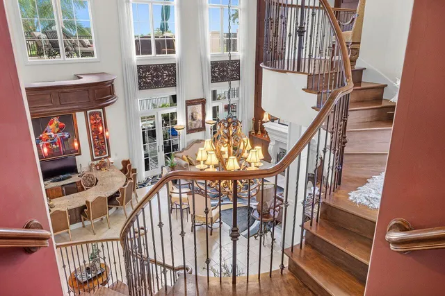 a living room with furniture cabinets and painting on the wall