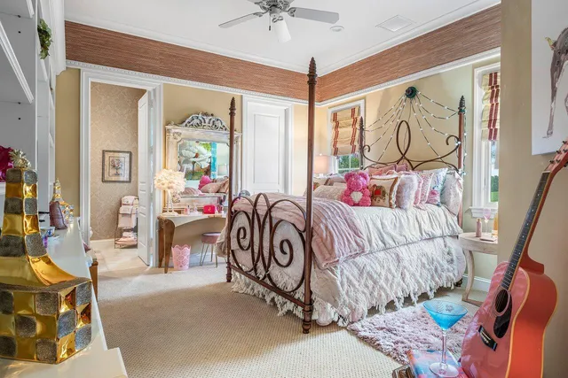 a bathroom with a granite countertop sink mirror vanity and toilet