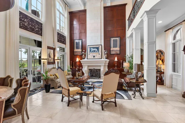 a view of a patio with dining table and chairs