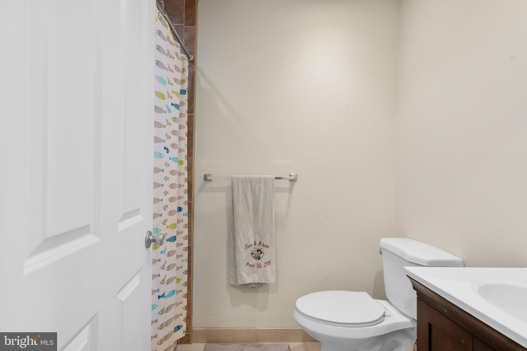 29 Concord Road Marlton, NJ 08053 - Photo 38 of 49 a white toilet sitting next to a shower curtain