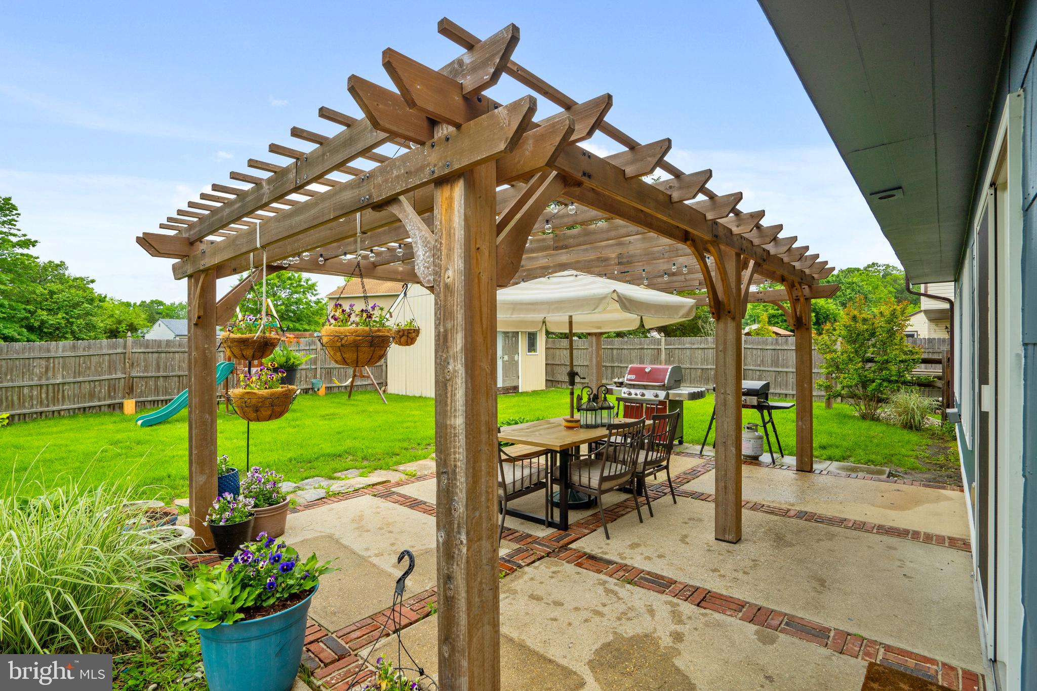 29 Concord Road Marlton, NJ 08053 - Photo 41 of 49 a view of a patio with table and chairs potted plants with wooden floor