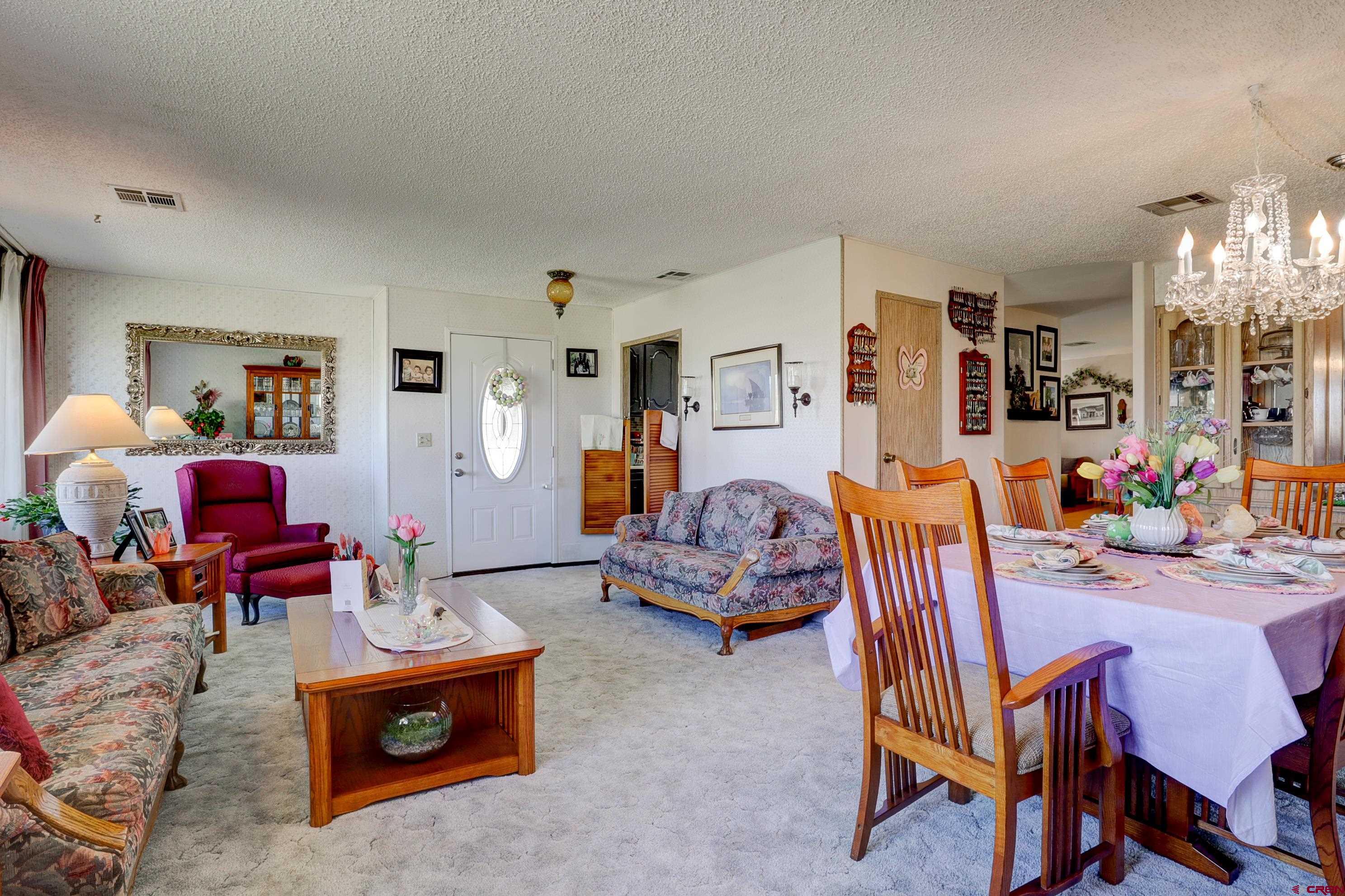 22705 Rd L Cortez, CO 81321 - Photo 13 of 30 a living room with furniture and a dining table
