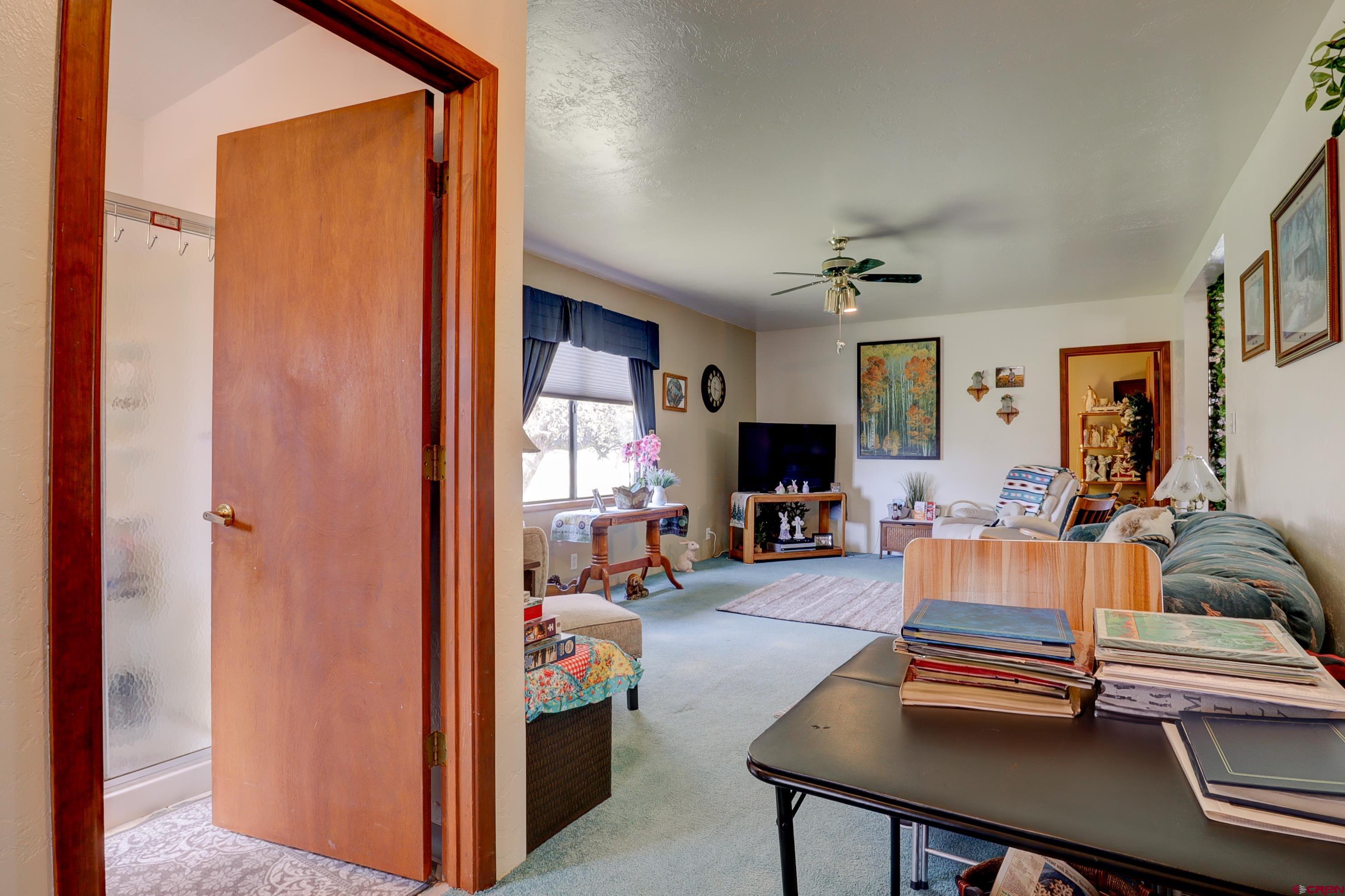 22705 Rd L Cortez, CO 81321 - Photo 19 of 30 a living room with furniture and a flat screen tv