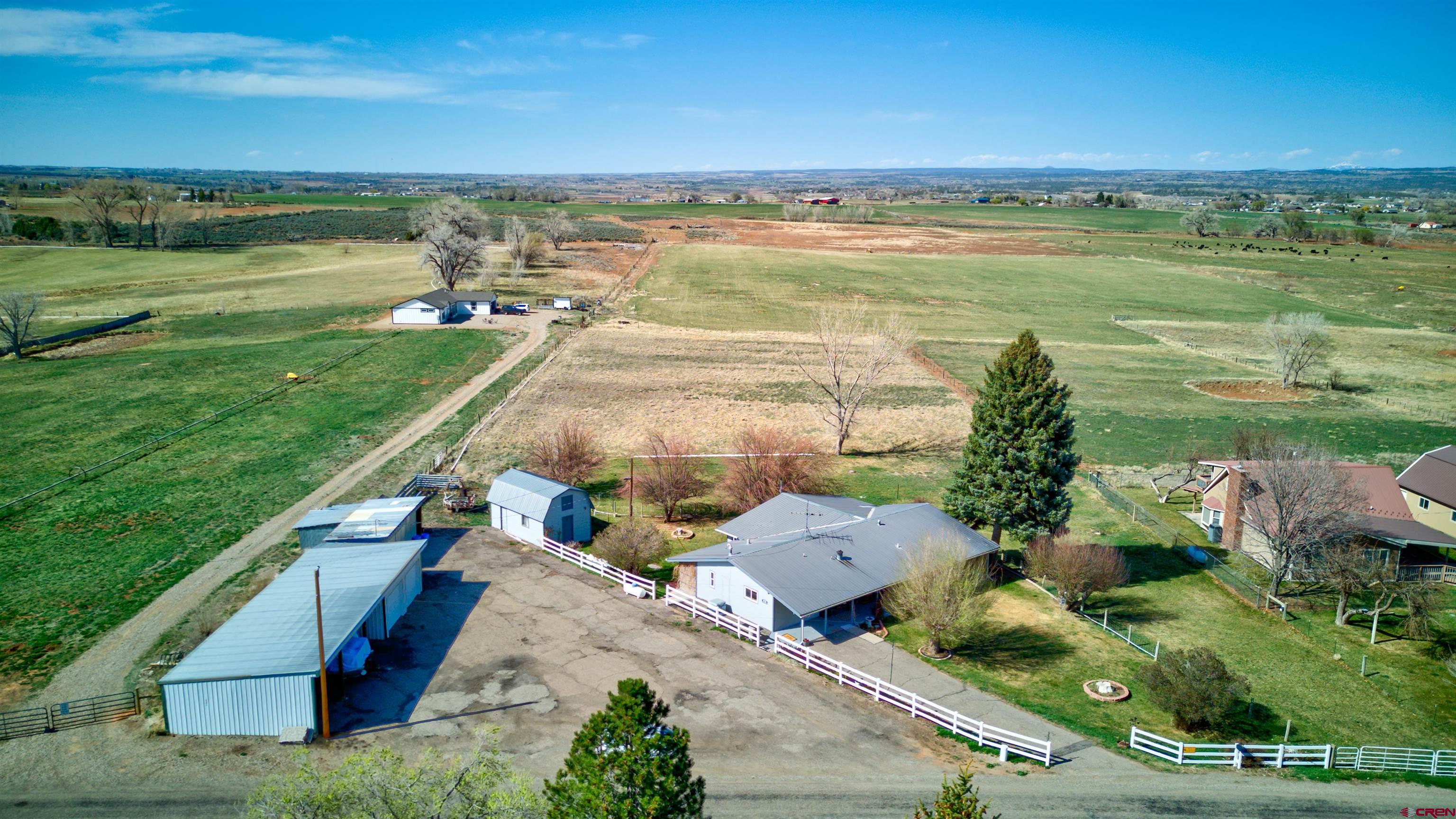 22705 Rd L Cortez, CO 81321 - Photo 27 of 30 an aerial view of residential houses with outdoor space and ocean