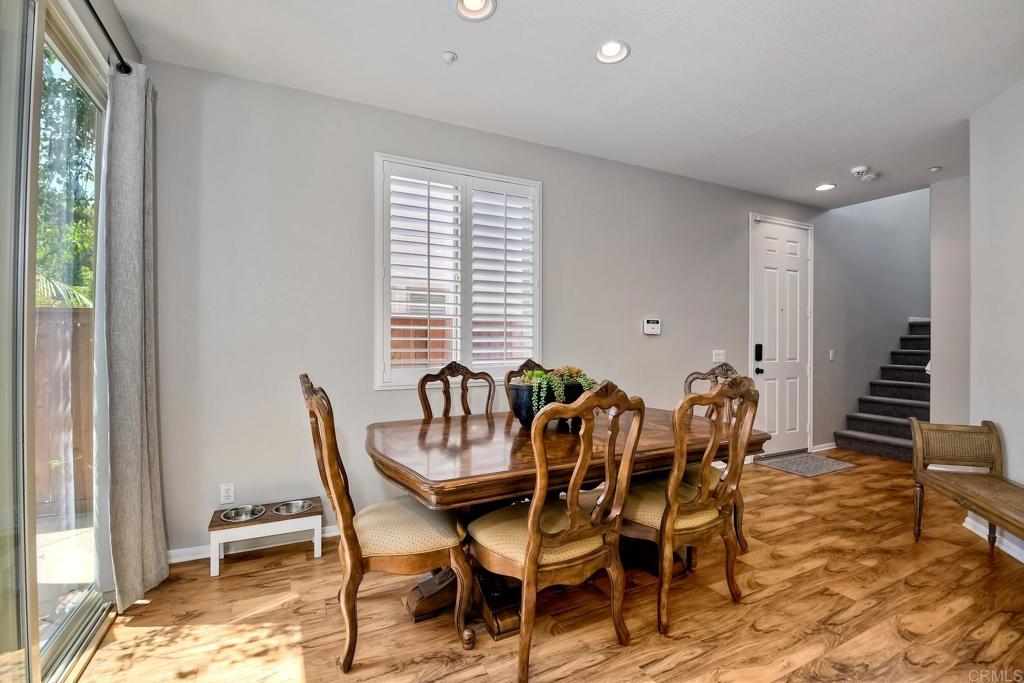 2256 Flatiron Way San Marcos, CA 92078 - Photo 9 of 22 a view of a dining room with furniture and wooden floor