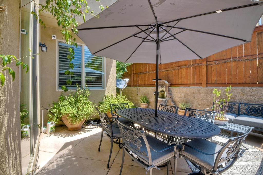 2256 Flatiron Way San Marcos, CA 92078 - Photo 10 of 22 a patio with a patio table and chairs