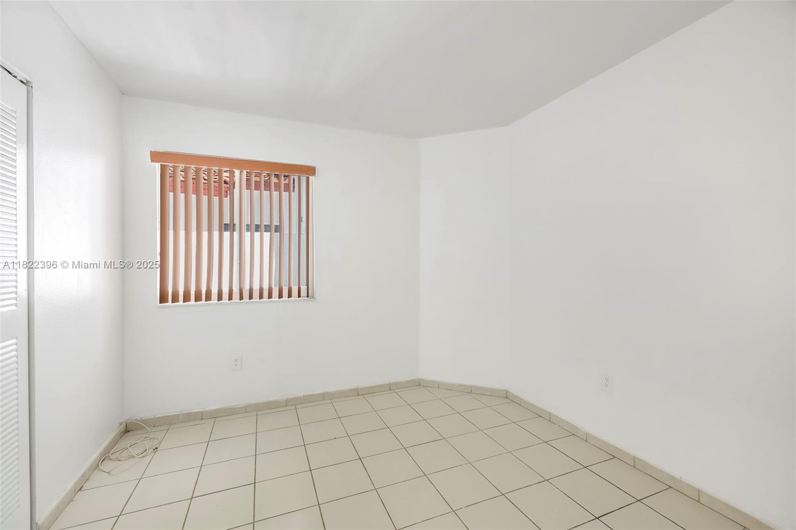 8421 Southwest 209th Street, Unit 8421 Cutler Bay, FL 33189 - Photo 11 of 16 a view of an empty room