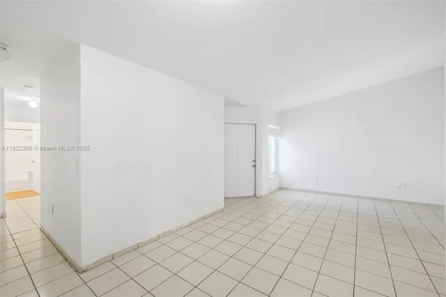 a view of an empty room and window