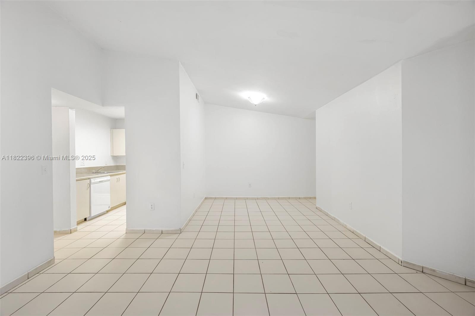 8421 Southwest 209th Street, Unit 8421 Cutler Bay, FL 33189 - Photo 14 of 16 a view of an empty room and window