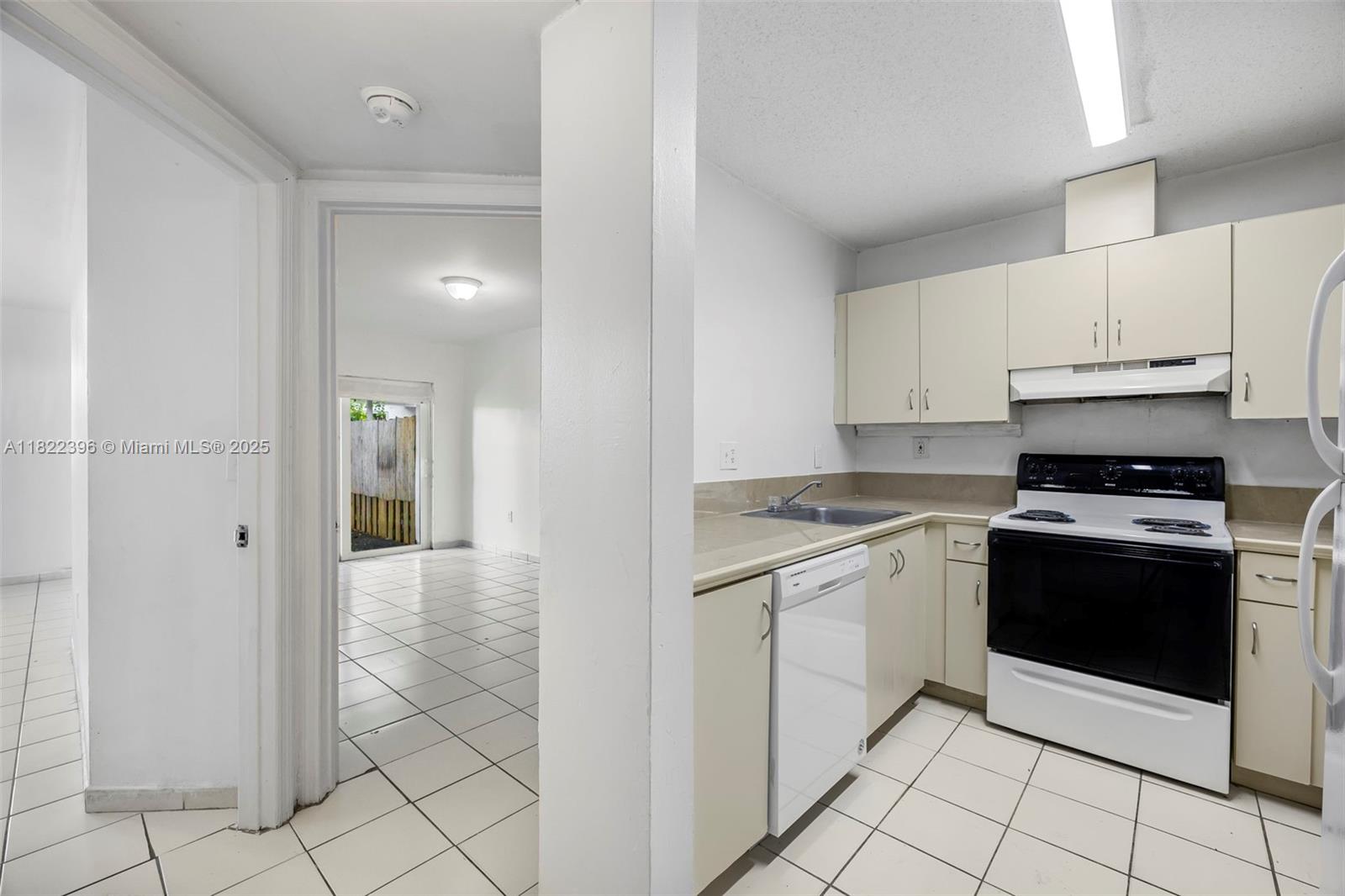 8421 Southwest 209th Street, Unit 8421 Cutler Bay, FL 33189 - Photo 4 of 16 a kitchen with stainless steel appliances granite countertop a stove a refrigerator and a cabinets