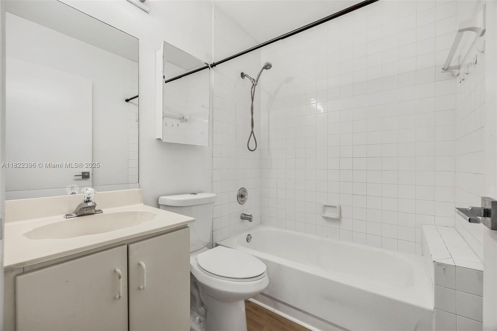 8421 Southwest 209th Street, Unit 8421 Cutler Bay, FL 33189 - Photo 10 of 16 a bathroom with a sink toilet tub and shower