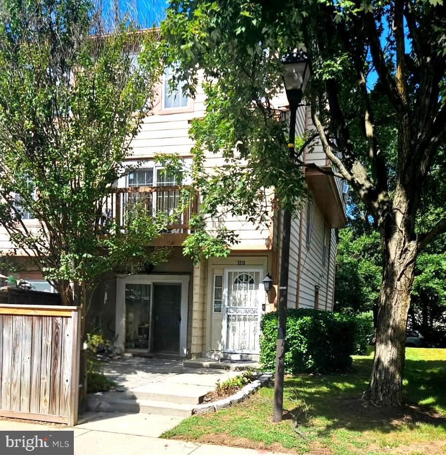 front view of a house with a tree
