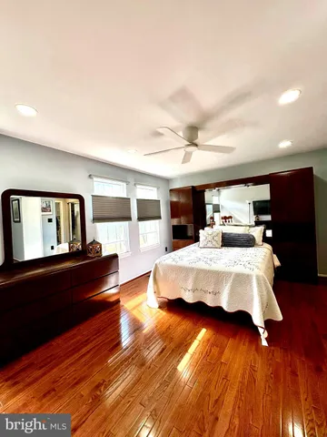 a bed room with a bed window and mirror