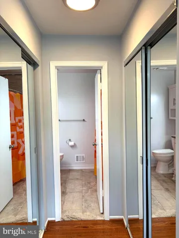 a view of a bathroom with a glass door and a glass door