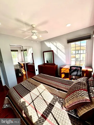 a bedroom with two beds and a window