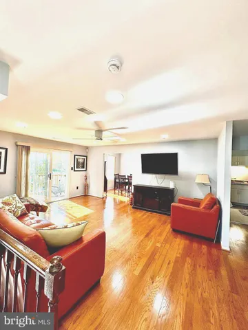 a living room with furniture and flat screen tv