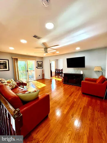 a room with furniture and a flat screen tv