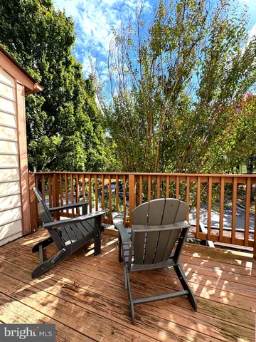 a view of a chair and table on the wooden floor