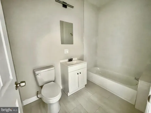 a bathroom with a toilet sink and bathtub