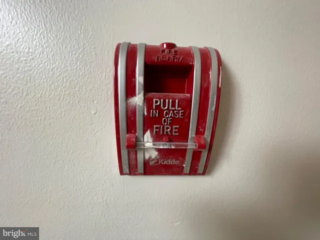 a sign that is sitting on a white wall