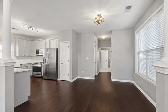 a view of a kitchen with a stove cabinets and wooden floor