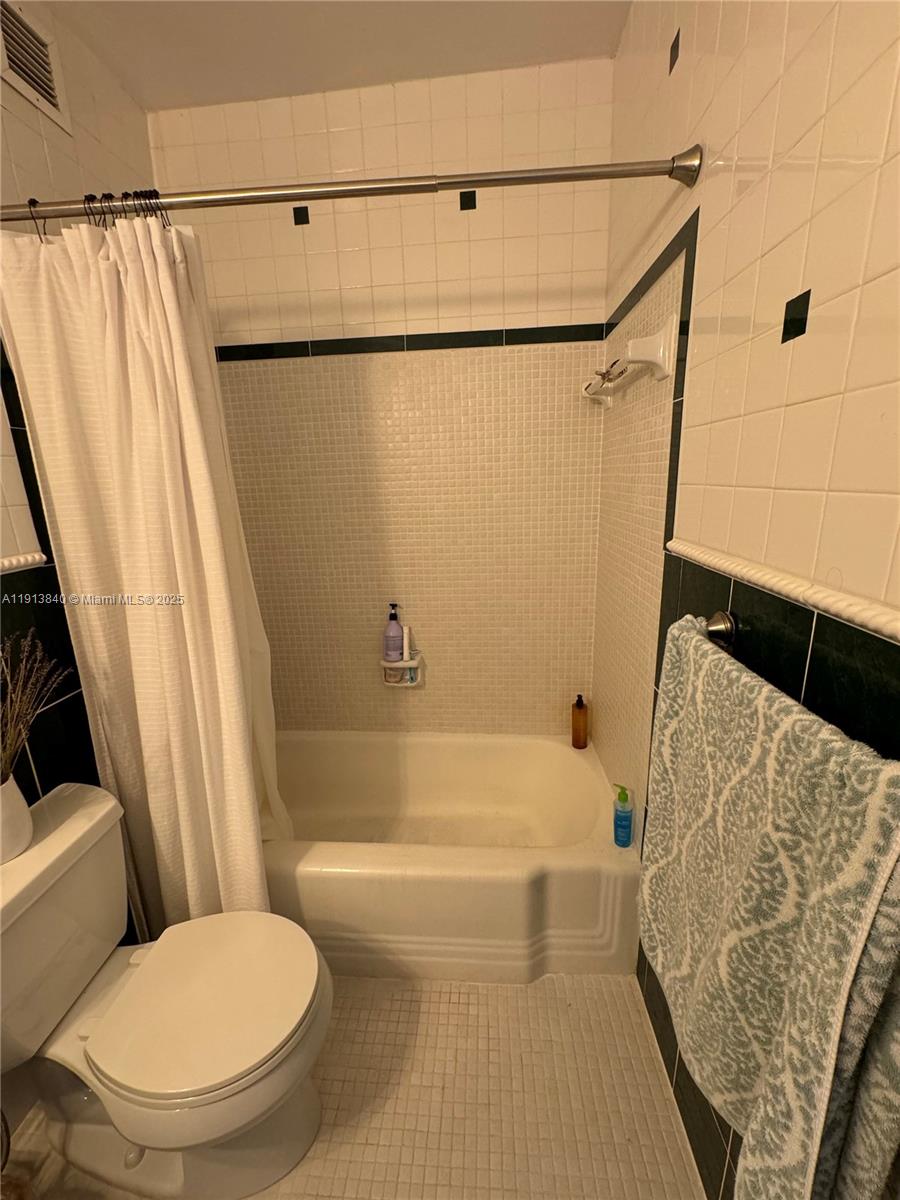 2451 Brickell Avenue, Unit 16U Miami, FL 33129 - Photo 17 of 17 a bathroom with a toilet and a bathtub