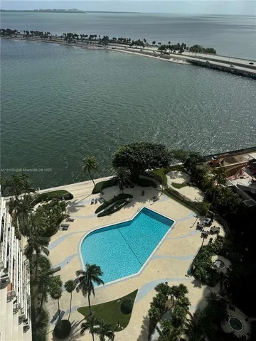 an aerial view of a residential houses with outdoor space