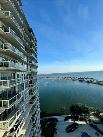 a view of a lake with a building in the background