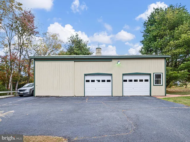 a view of empty room with wooden ceiling