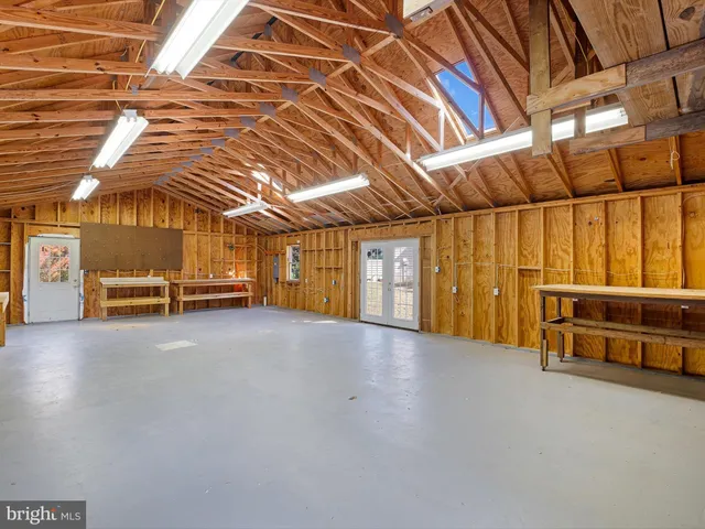 swimming pool view with a garden space