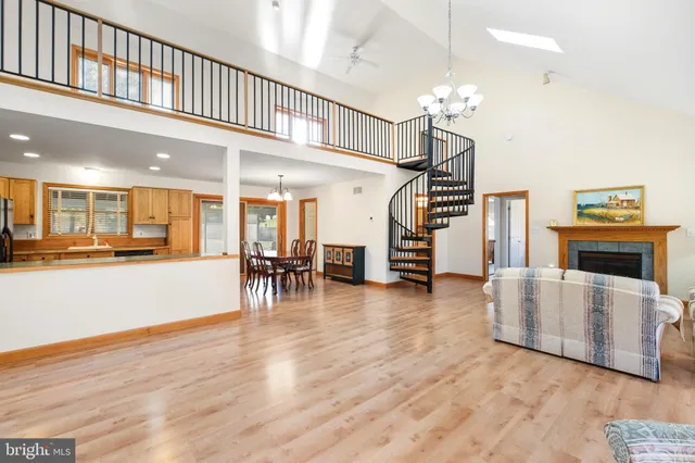 a view of a livingroom with furniture and a kitchen