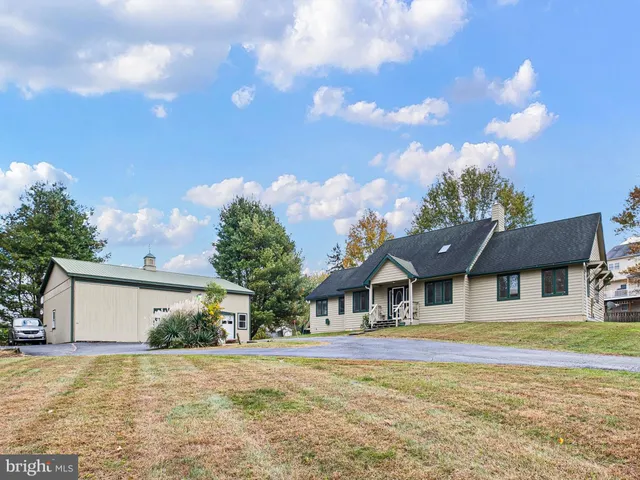 an aerial view of a house with a swimming pool