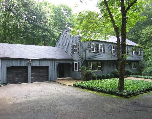 55 Old Long Ridge Road Stamford, CT 06903 - Photo 1 of 1 a front view of a house with a yard and garage