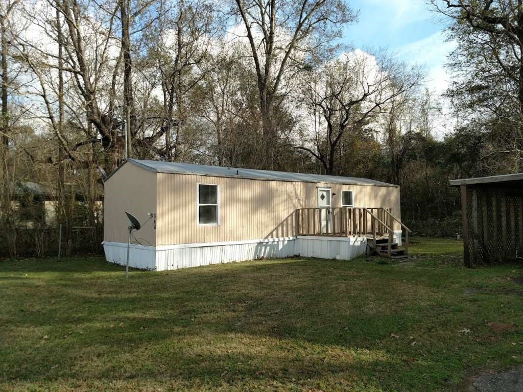 368 Pine Ridge Drive Cleveland, TX 77327 - Photo 1 of 27 a view of back yard of the house