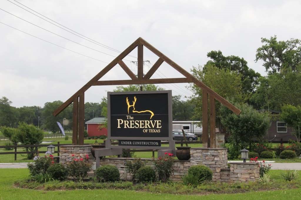368 Pine Ridge Drive Cleveland, TX 77327 - Photo 12 of 27 a view of outdoor space with signage and flags