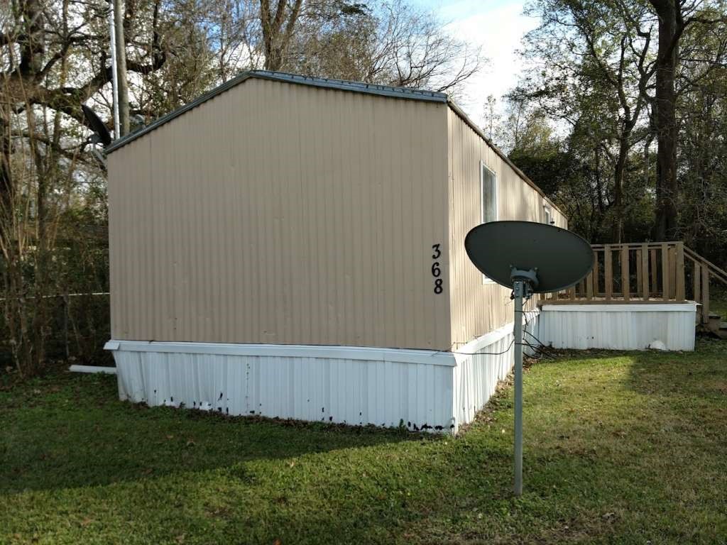 368 Pine Ridge Drive Cleveland, TX 77327 - Photo 3 of 27 a view of a back yard of the house