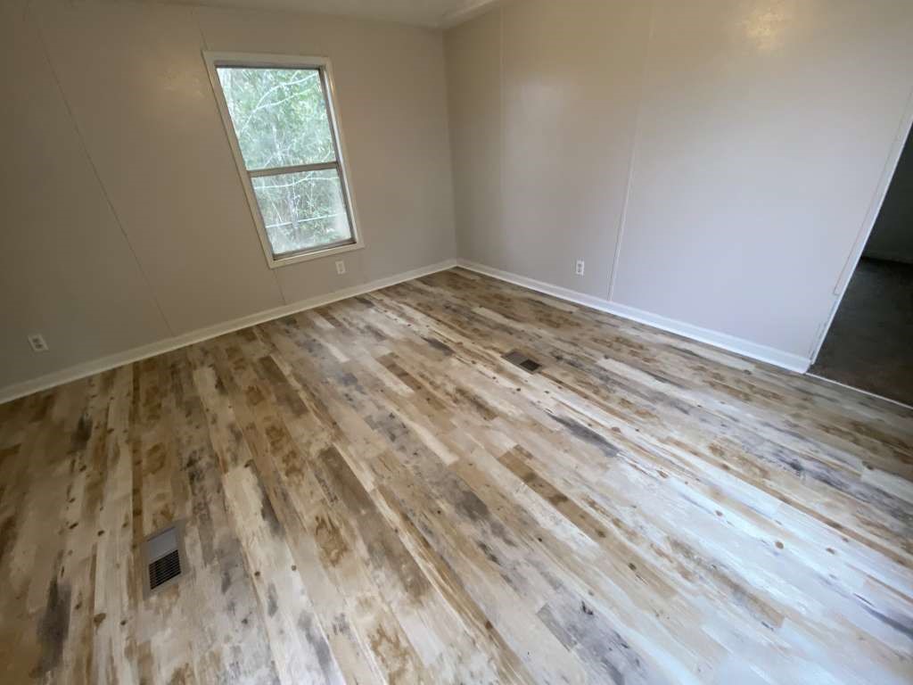 368 Pine Ridge Drive Cleveland, TX 77327 - Photo 9 of 27 a view of room with window and hardwood floor