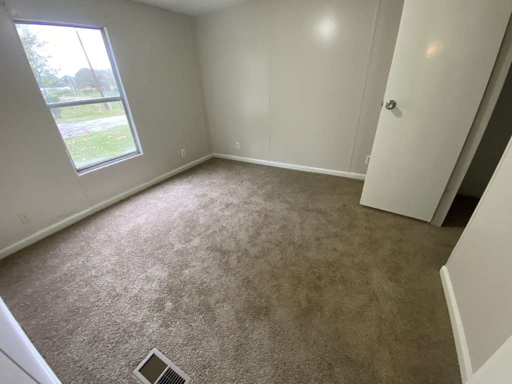 368 Pine Ridge Drive Cleveland, TX 77327 - Photo 10 of 27 an empty room with windows
