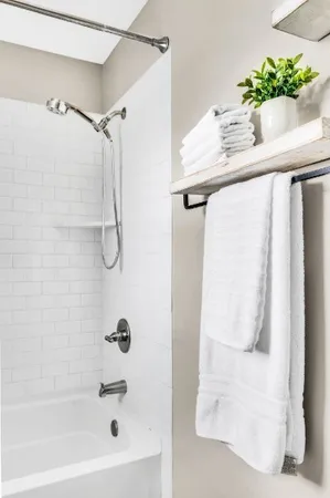 a bathroom with a shower and a sink