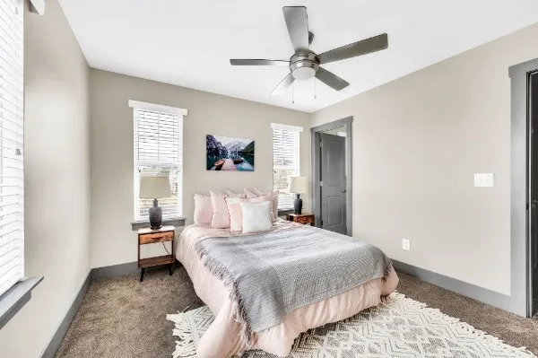 a bedroom with a bed and a window