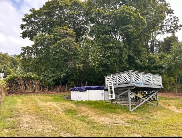 a view of a swimming pool with a table and chairs