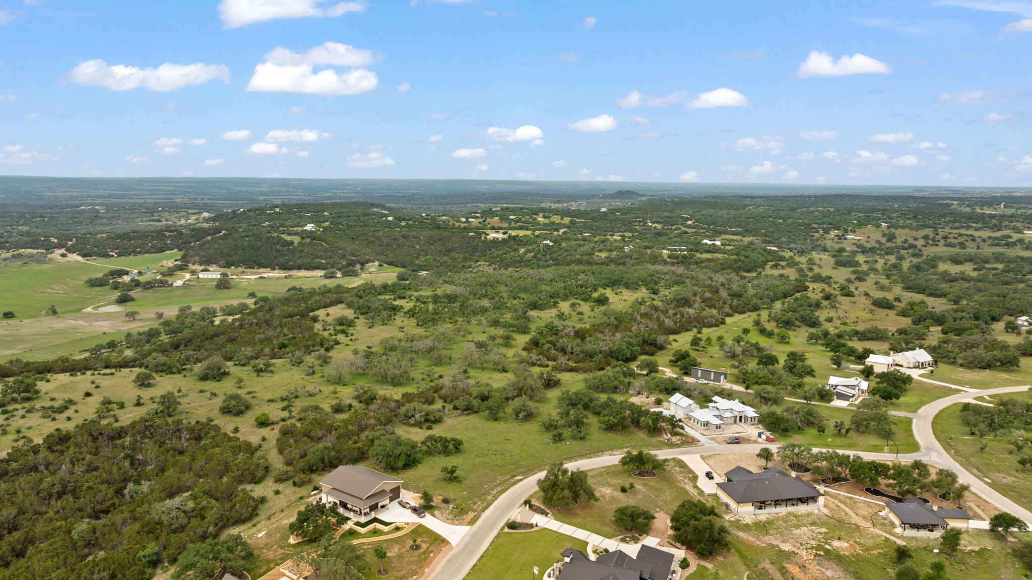 120 Trophy Oak Point Fredericksburg, TX 78624 - Photo 16 of 33 Aerial view of property and surrounding area featuring a heavily wooded area