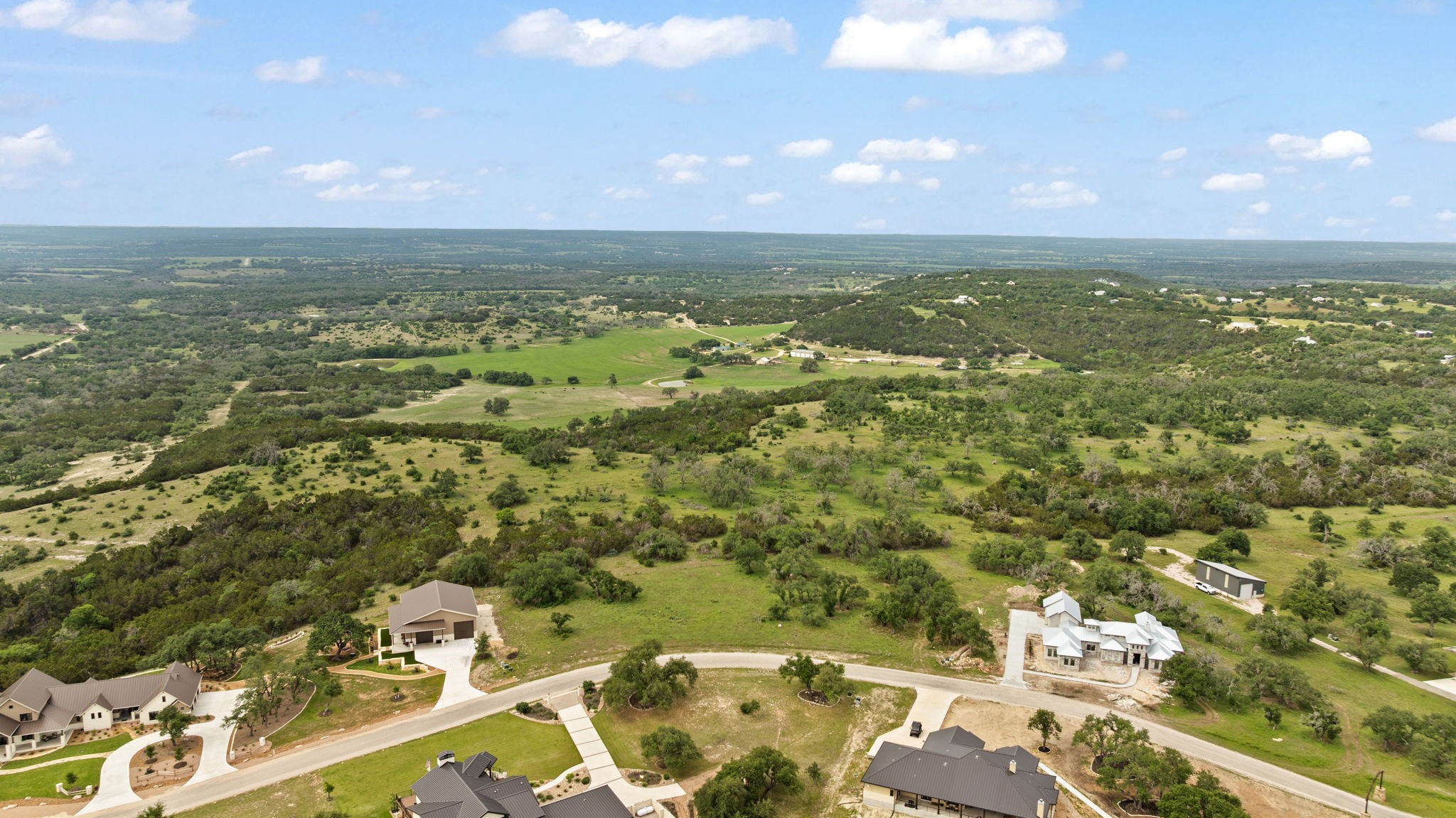 120 Trophy Oak Point Fredericksburg, TX 78624 - Photo 17 of 33 Aerial overview of property's location with nearby suburban area and a heavily wooded area
