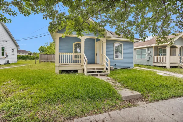 front view of a house with a yard