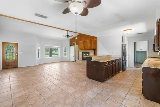 a view of a kitchen with furniture and a window