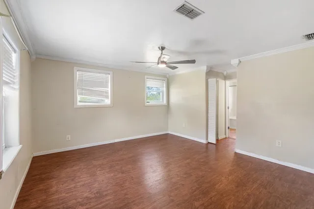 a bathroom with a sink and mirror with bathtub