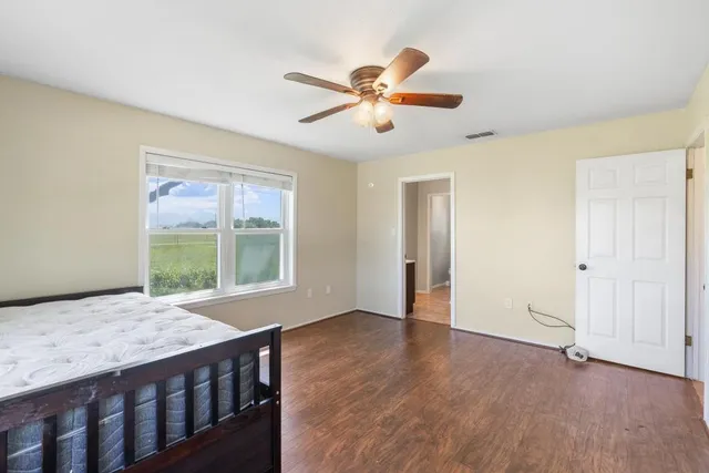 a living room with a bed furniture and a window